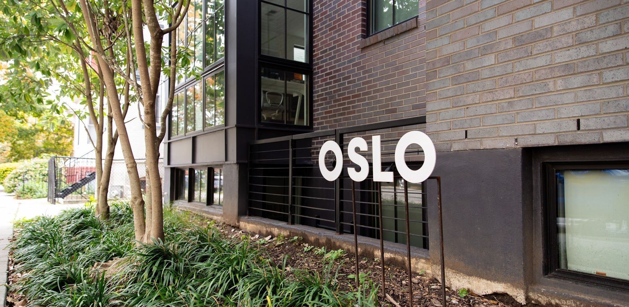 OSLOAdmo building exterior with plants and OSLO sign in Washington, D.C.