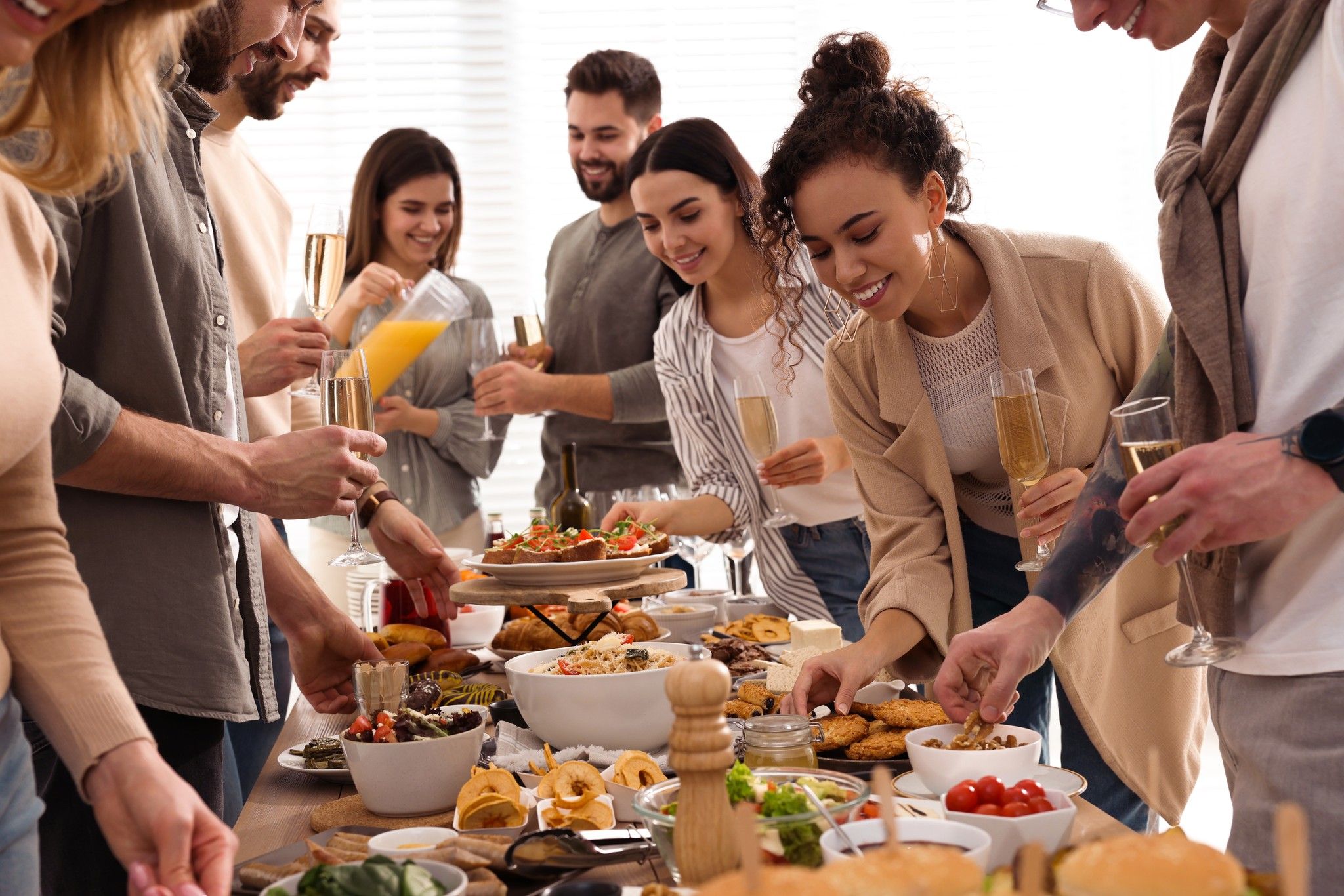 Group of people enjoying brunch buffet together indoors