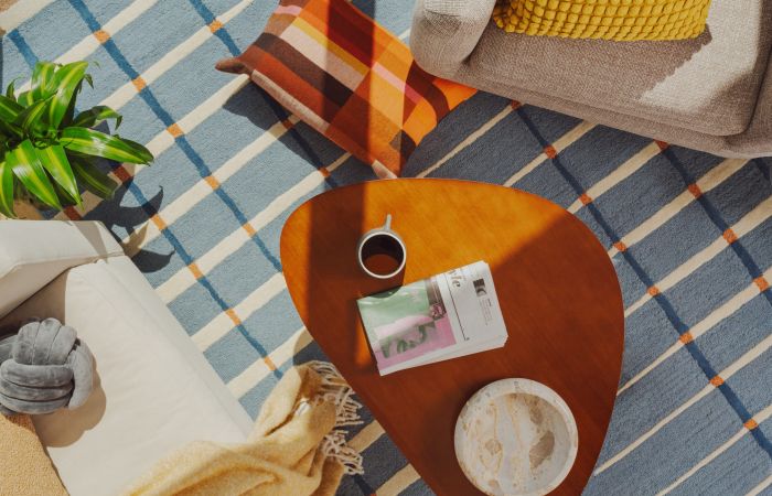Group of friends enjoying a movie night at home with snacks and drinks